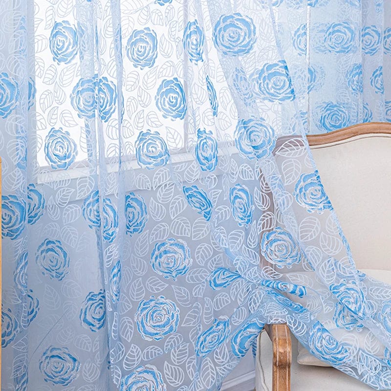 Voilage bleu à motifs roses