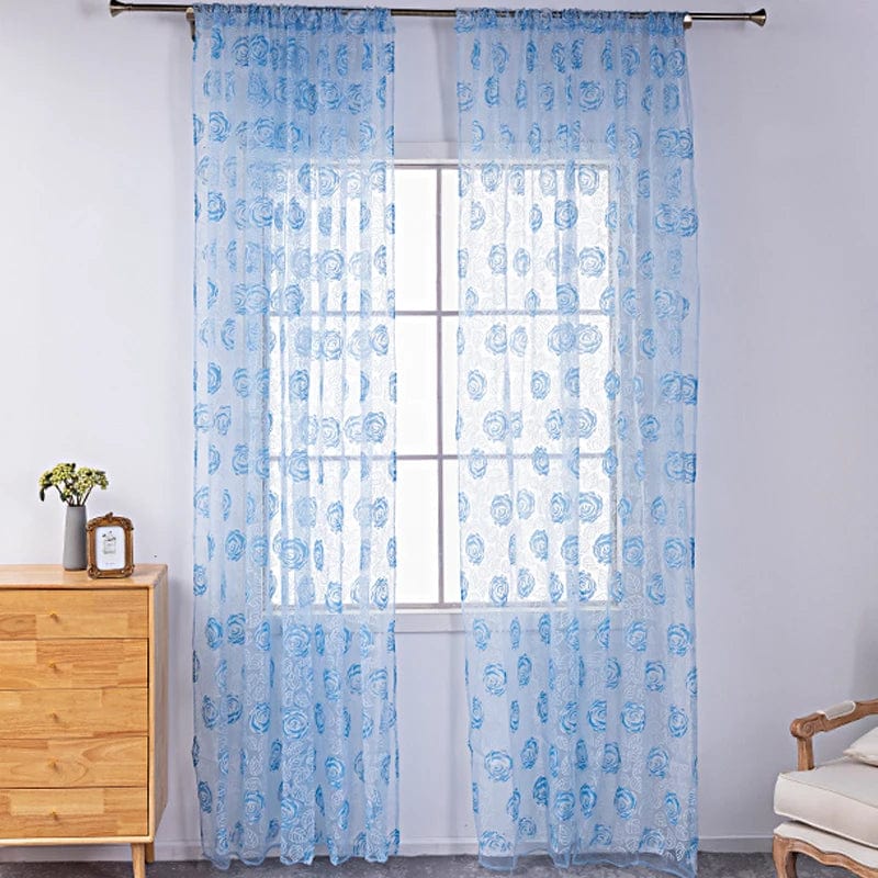 Voilage bleu à motifs roses